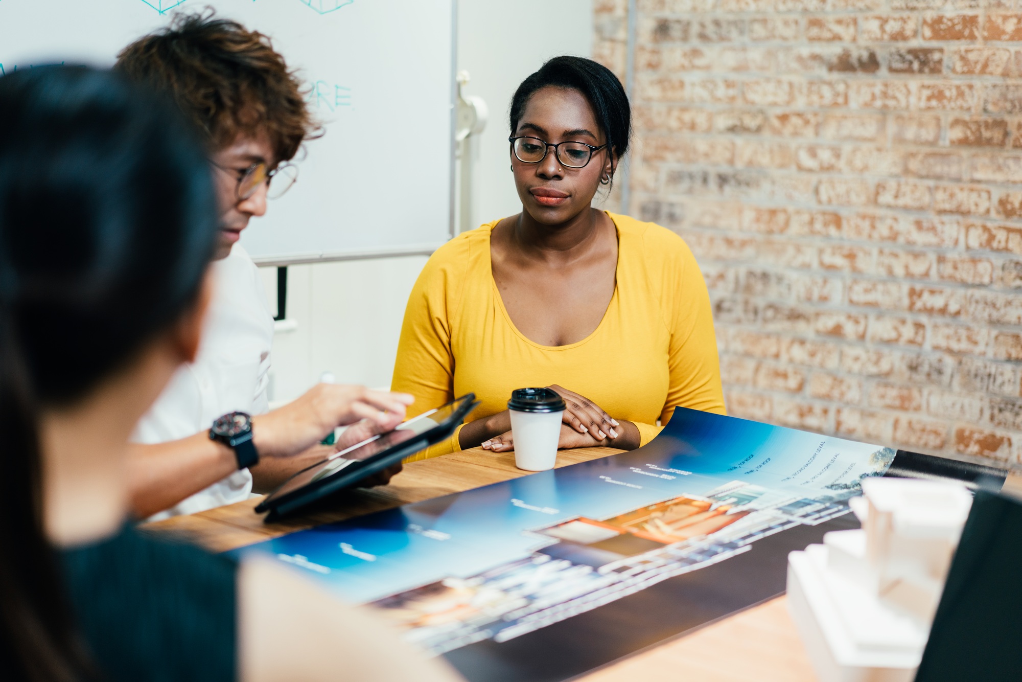 African American female client listening architecture design presentation