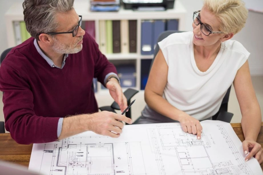 architect discussing residential building plans with client during consultation